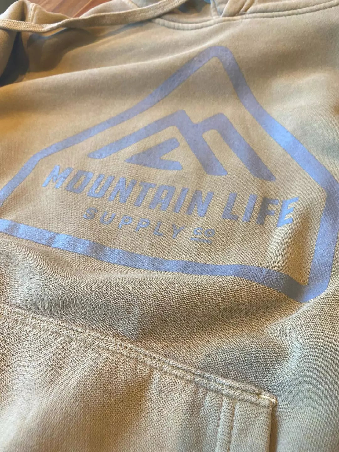 A mountain life supply branded sweatshirt