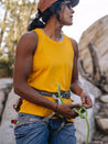 Rock climbing woman wearing the Switchback classic fit tank top